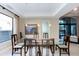 Elegant dining room featuring a glass table and dark wood chairs at 7878 E Gainey Ranch Rd # 3, Scottsdale, AZ 85258