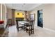 Elegant dining room with glass table and view into kitchen at 7878 E Gainey Ranch Rd # 3, Scottsdale, AZ 85258