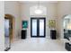 Elegant entryway with high ceilings, tiled floors, and double doors at 7878 E Gainey Ranch Rd # 3, Scottsdale, AZ 85258