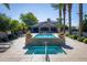 Resort-style pool and spa with lounge chairs and umbrellas at 7878 E Gainey Ranch Rd # 3, Scottsdale, AZ 85258