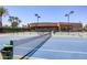 Well-maintained tennis court with surrounding landscaping at 7878 E Gainey Ranch Rd # 3, Scottsdale, AZ 85258