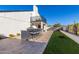 Outdoor kitchen, grassy area, and a mural at 8025 E Redwing Rd, Scottsdale, AZ 85250