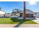 Stunning home exterior with a manicured lawn and palm trees at 8025 E Redwing Rd, Scottsdale, AZ 85250