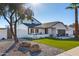 House exterior showcasing a large yard and rock landscaping at 8025 E Redwing Rd, Scottsdale, AZ 85250