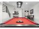 Game room features a pool table, bar-height seating, and artwork at 8025 E Redwing Rd, Scottsdale, AZ 85250