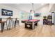 Game room with pool table, arcade games, and bar-height seating at 8025 E Redwing Rd, Scottsdale, AZ 85250