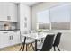 Eat-in kitchen with white cabinets and a marble top table at 8025 E Redwing Rd, Scottsdale, AZ 85250