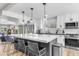 Bright kitchen features white shaker cabinets, a large island, and an open floor plan at 8025 E Redwing Rd, Scottsdale, AZ 85250