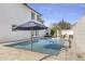 Inviting backyard pool with patio furniture and umbrella at 8025 E Redwing Rd, Scottsdale, AZ 85250