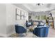 Cozy sitting area with blue velvet chairs and a geometric coffee table at 8025 E Redwing Rd, Scottsdale, AZ 85250