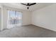 Spacious bedroom with carpet, ceiling fan, and sliding door to balcony at 832 W 14Th St, Tempe, AZ 85281