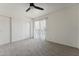 Bedroom with carpet, ceiling fan and sliding door to balcony at 832 W 14Th St, Tempe, AZ 85281