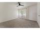 Bright bedroom with carpet, ceiling fan and window at 832 W 14Th St, Tempe, AZ 85281