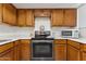 Updated kitchen with wood cabinets and stainless steel appliances at 832 W 14Th St, Tempe, AZ 85281