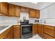 Clean kitchen offering wood cabinets and stainless steel appliances at 832 W 14Th St, Tempe, AZ 85281