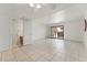 Living room with tile floors, ceiling fan and sliding door to patio at 832 W 14Th St, Tempe, AZ 85281