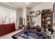 Bedroom with decorative rug, shelving unit, and Gathering photos at 8631 W Monte Vista Rd, Phoenix, AZ 85037