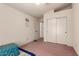 Small bedroom with twin bed and built-in closet at 8631 W Monte Vista Rd, Phoenix, AZ 85037