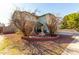 Two-story house with a fountain and landscaping in the front yard at 8631 W Monte Vista Rd, Phoenix, AZ 85037