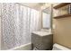 Simple bathroom with a tub shower and updated vanity at 8707 N 3Rd Ave, Phoenix, AZ 85021