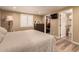 Bright bedroom with a king-size bed, private bath, and walk-in closet at 8707 N 3Rd Ave, Phoenix, AZ 85021