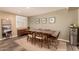 Charming dining area with mid-century modern table and chairs at 8707 N 3Rd Ave, Phoenix, AZ 85021