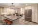 Modern kitchen with island, stainless steel appliances, and hardwood floors at 8707 N 3Rd Ave, Phoenix, AZ 85021