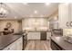 Updated kitchen featuring white cabinets, gas cooktop, and stylish backsplash at 8707 N 3Rd Ave, Phoenix, AZ 85021