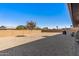 Landscaped backyard with gravel and a small tree at 9714 W Rodeo Ct, Sun City, AZ 85373