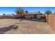 Large backyard with gravel, a tree and a view of the house at 9714 W Rodeo Ct, Sun City, AZ 85373