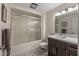 Updated bathroom with a walk-in shower and modern vanity at 9714 W Rodeo Ct, Sun City, AZ 85373