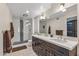 Modern bathroom with double vanity and a large shower at 9714 W Rodeo Ct, Sun City, AZ 85373