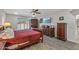 Main bedroom with a comfortable bed and access to a patio at 9714 W Rodeo Ct, Sun City, AZ 85373