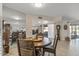 Bright dining area with view to living room and kitchen at 9714 W Rodeo Ct, Sun City, AZ 85373