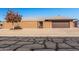 Front view of a tan brick house with a brown garage door at 9714 W Rodeo Ct, Sun City, AZ 85373