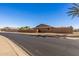 Back exterior view of the property, showing a wall and part of the house at 9714 W Rodeo Ct, Sun City, AZ 85373