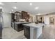 Spacious kitchen with island and stainless steel appliances at 9714 W Rodeo Ct, Sun City, AZ 85373