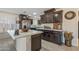 Modern kitchen with dark wood cabinets and ample counter space at 9714 W Rodeo Ct, Sun City, AZ 85373