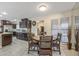 Kitchen with dark wood cabinets and an island at 9714 W Rodeo Ct, Sun City, AZ 85373