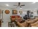 Bright living room with a ceiling fan and comfortable seating at 9714 W Rodeo Ct, Sun City, AZ 85373