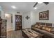 Cozy living room features a sofa, coffee table, and built-in shelving at 9714 W Rodeo Ct, Sun City, AZ 85373