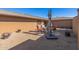 Backyard patio with seating, umbrella, and desert plants at 9714 W Rodeo Ct, Sun City, AZ 85373