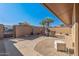 Private backyard patio with seating and desert landscaping at 9714 W Rodeo Ct, Sun City, AZ 85373