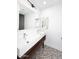 Bathroom with double vanity, patterned floor tile and modern fixtures at 9789 E Cinnabar Ave, Scottsdale, AZ 85258