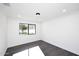 Light and airy bedroom featuring dark wood floors at 9789 E Cinnabar Ave, Scottsdale, AZ 85258