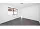 Bright bedroom with dark wood floors and a window at 9789 E Cinnabar Ave, Scottsdale, AZ 85258