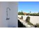 Outdoor shower with stone pathway and lush greenery at 9789 E Cinnabar Ave, Scottsdale, AZ 85258