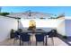 Outdoor patio with table, chairs, and umbrella at 9789 E Cinnabar Ave, Scottsdale, AZ 85258