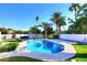 Relaxing pool area with palm trees and grassy lawn at 9789 E Cinnabar Ave, Scottsdale, AZ 85258