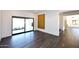 Bright sitting area with wood-look floors and sliding glass doors to a patio at 9789 E Cinnabar Ave, Scottsdale, AZ 85258